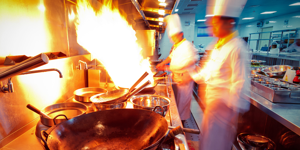 Preparing food in a cast-iron wok